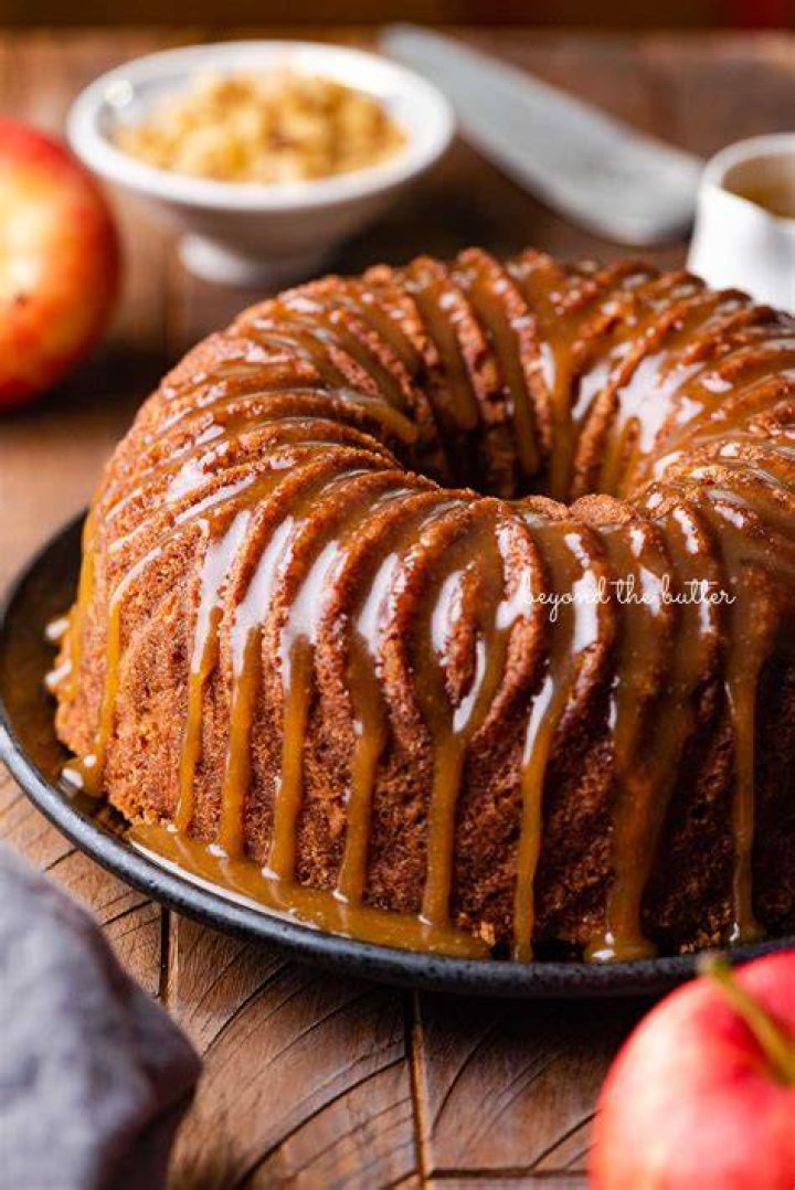 Apple bundt cake on a white platter.