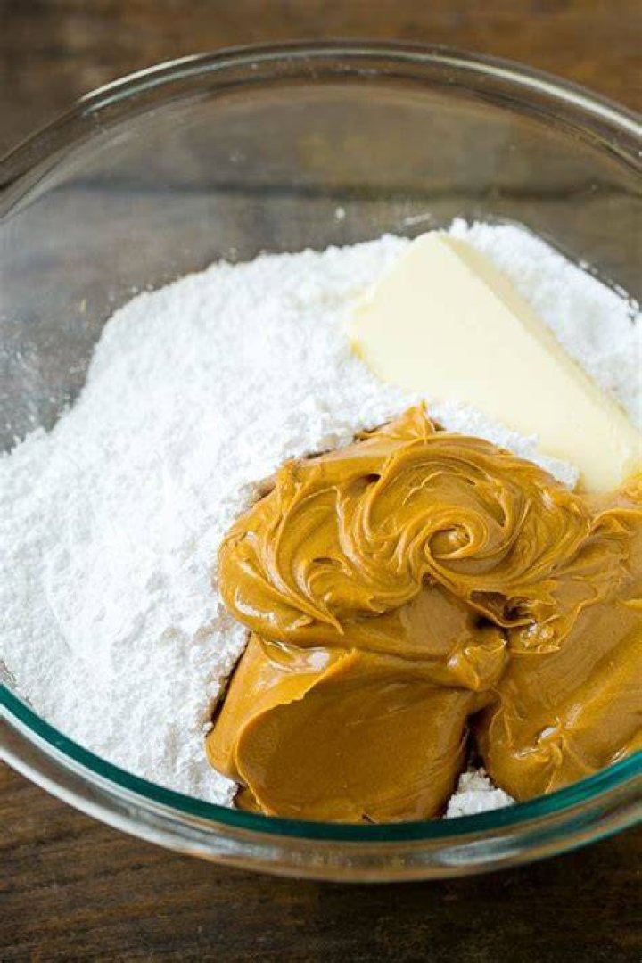Butter and powdered sugar in a white bowl.