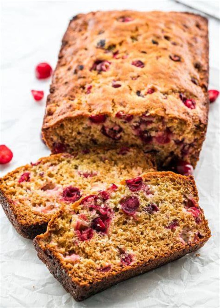 Two slices of cranberry bread on a white plate.