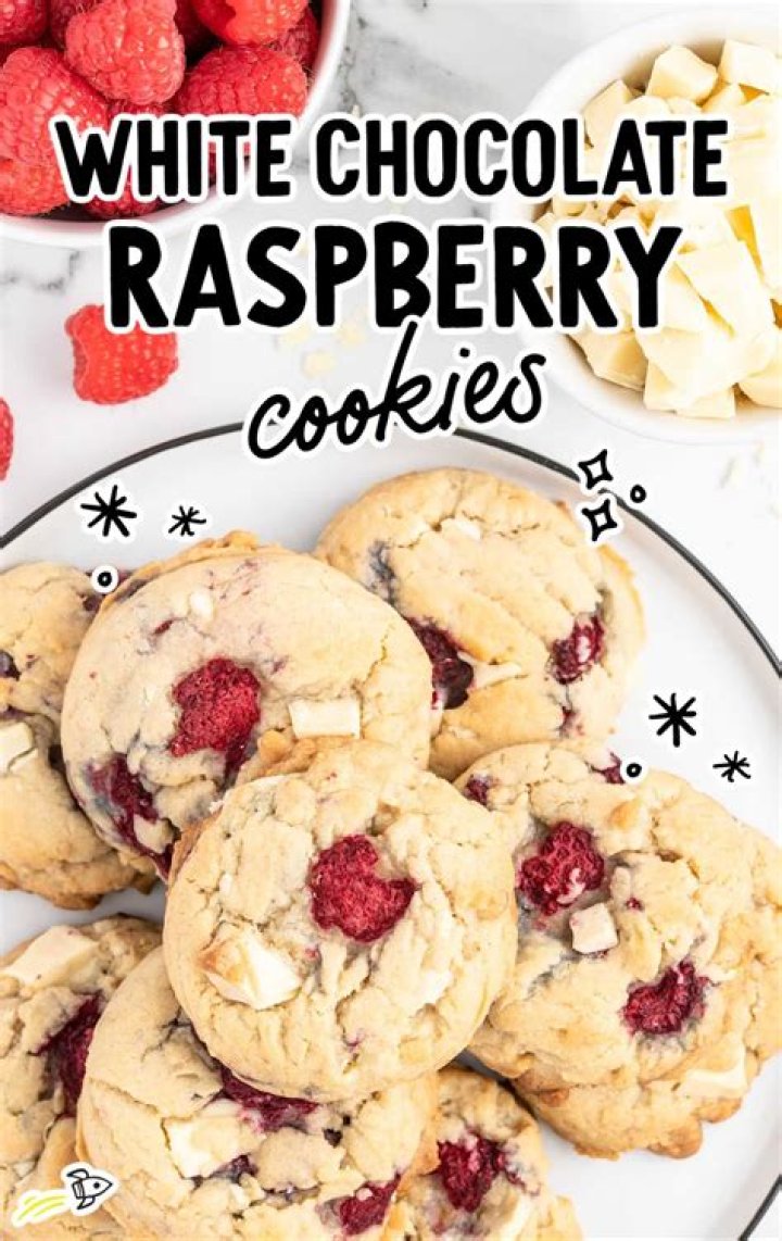 White chocolate raspberry cookies on a piece of parchment paper.